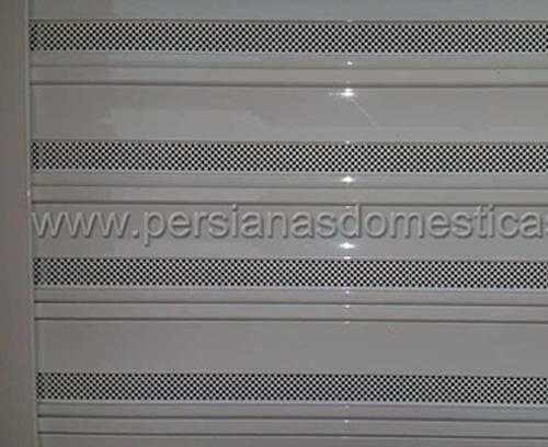 Instalación de persianas autoblocantes microperforadas en Premià de Mar